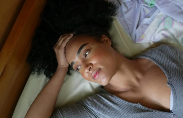 African American woman feeling Insomnia in bed