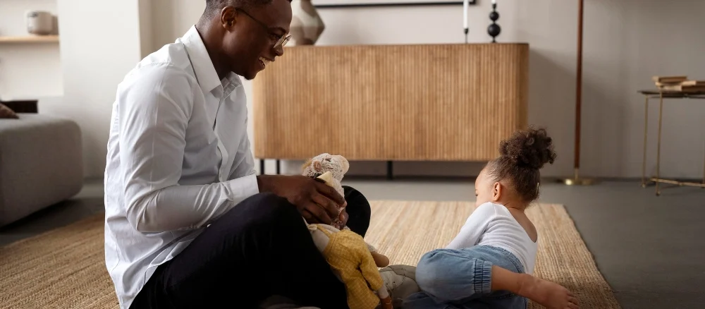 Black baby spending time with her dad