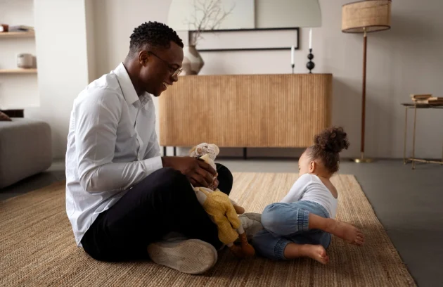 Black baby spending time with her dad