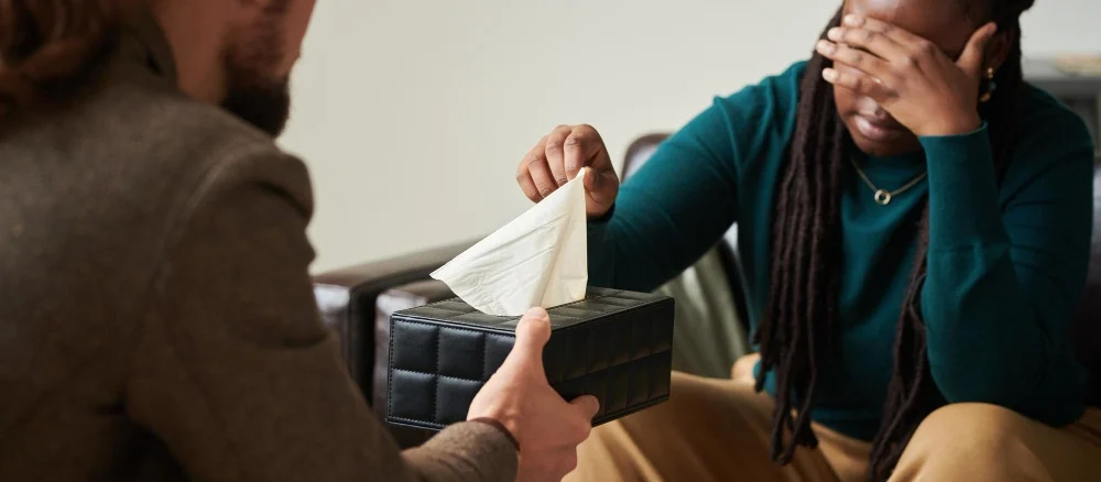 Psychiatrist giving tissues to patient with Panic Attacks and Panic Disorder