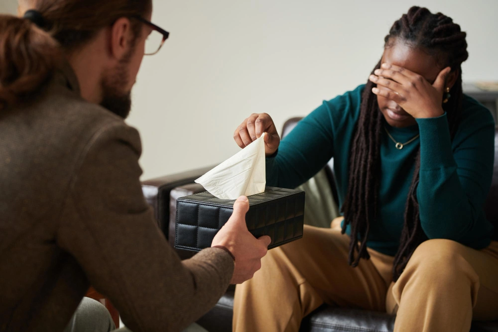 Psychiatrist giving tissues to patient with Panic Attacks and Panic Disorder