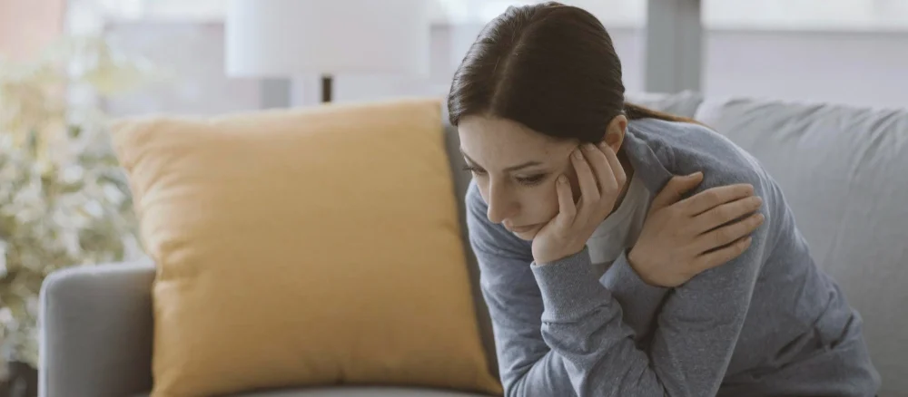 Sad Anxiety woman self isolating at home