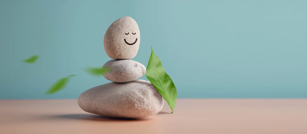 Enjoying Life Harmony and Positive Mind Concept Stack of Stable Pebble Stone with Smiling Face